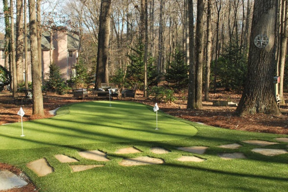 Naperville backyard putting green with flags and trees